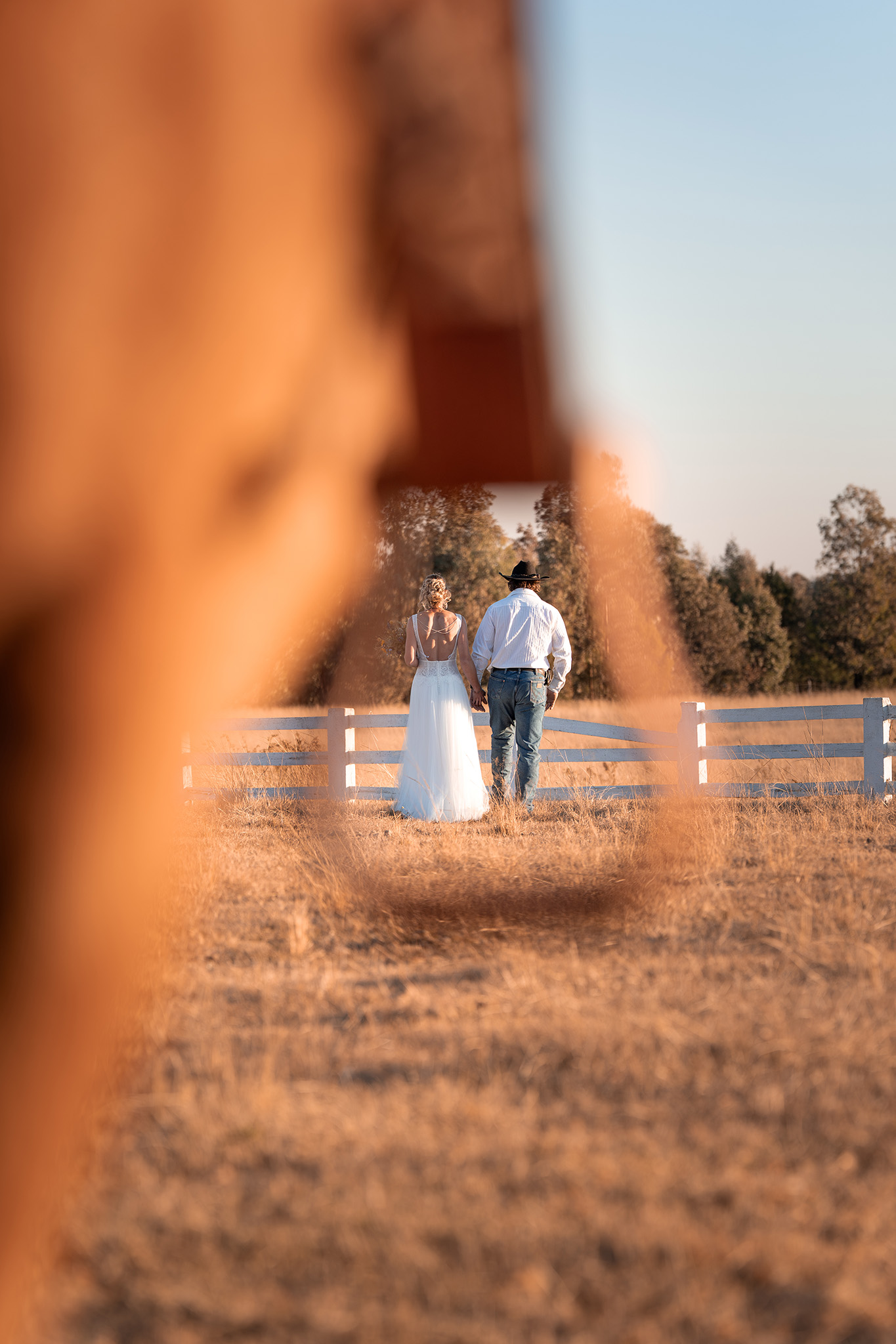 Couple framed in saddle stirrup