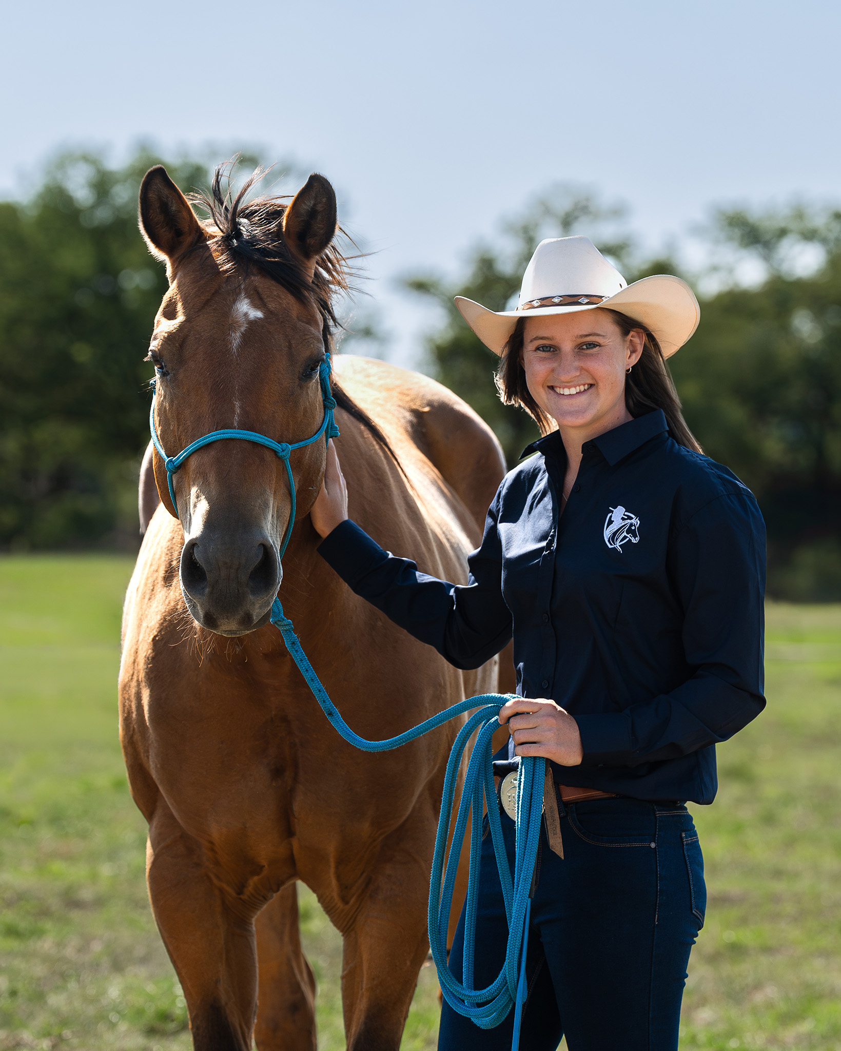 Portrait of a female horse trainer and her horse