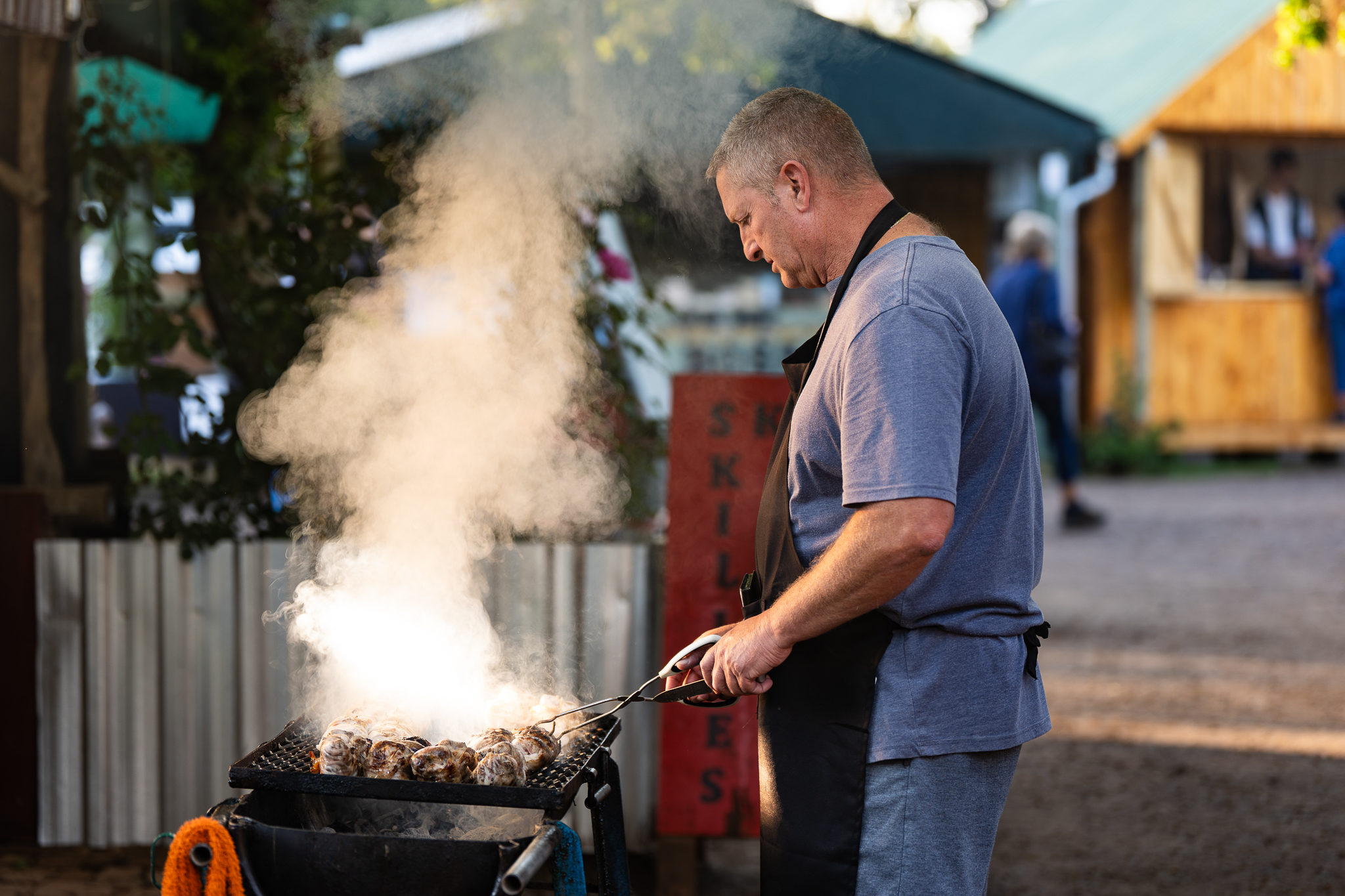 A vendor preparing food at the Pretoria Boeremark