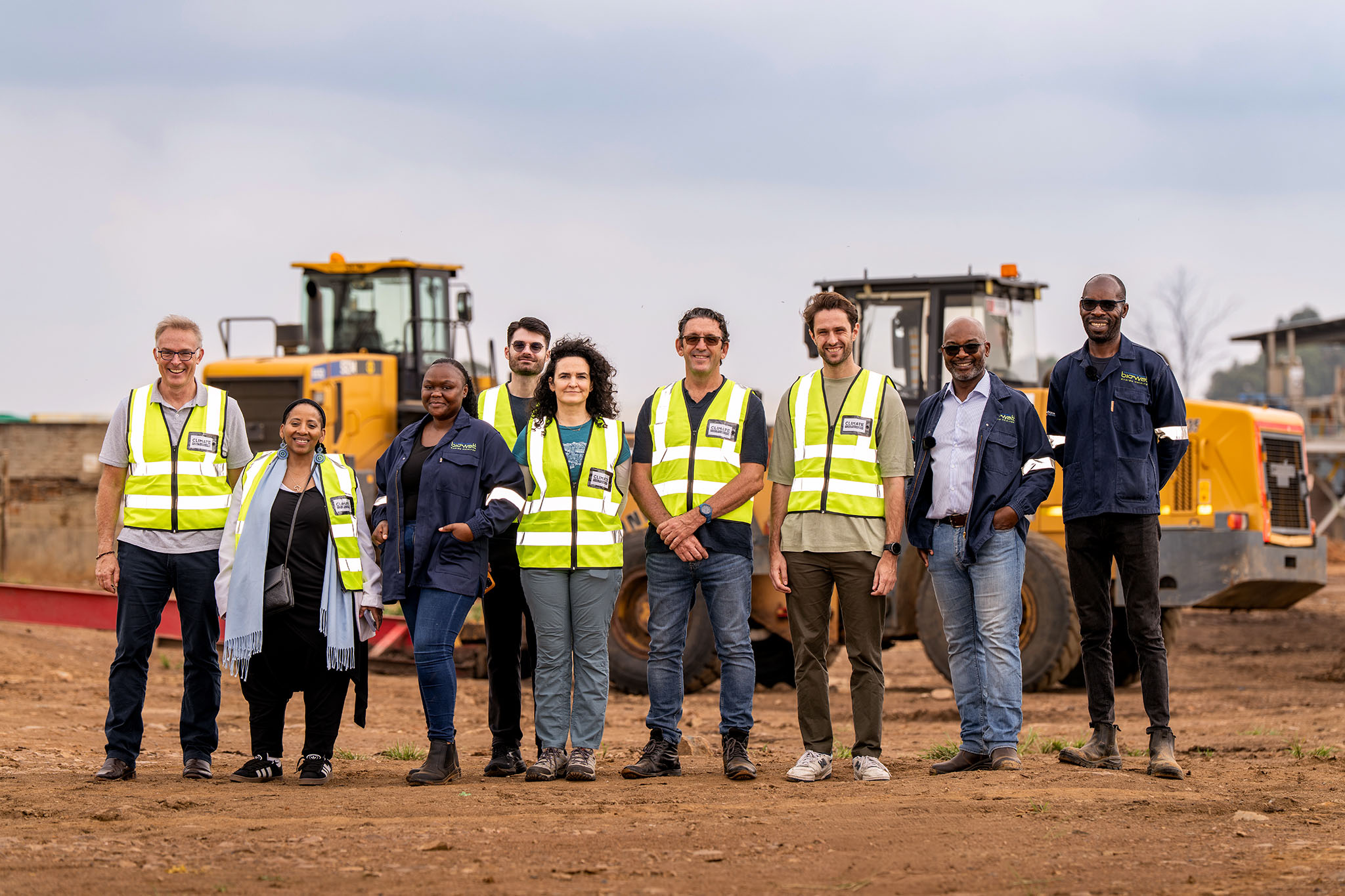 An image of corporate executives during an industrial plant site visit in South Africa