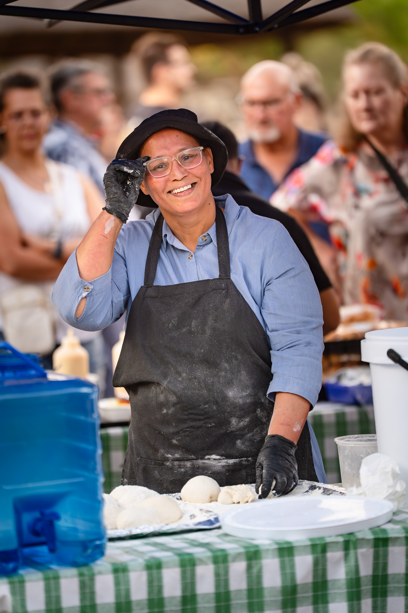 Lady making roosterkoek at the Pretoria Boeremark