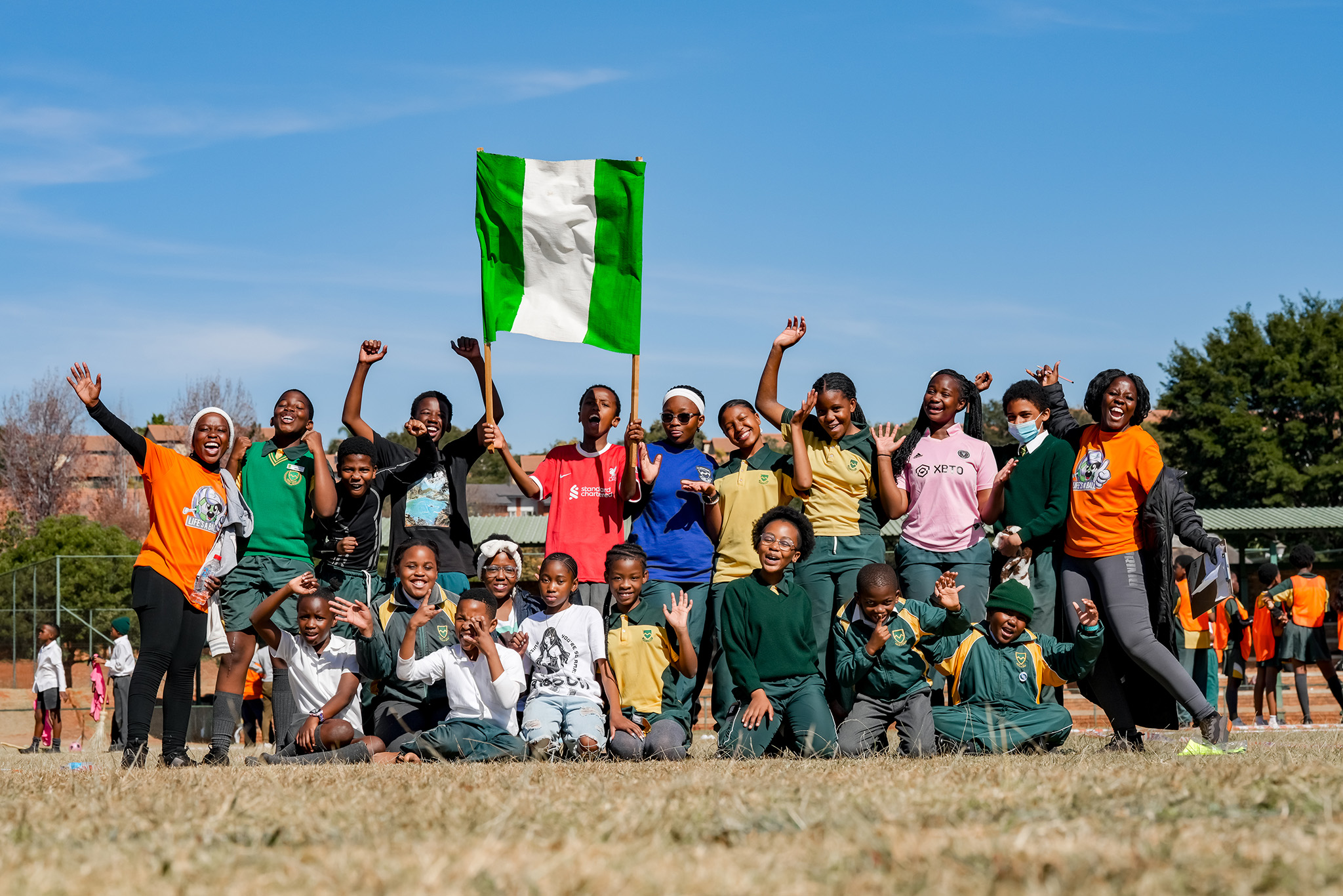 Kids pose for the camera at a charity sports event