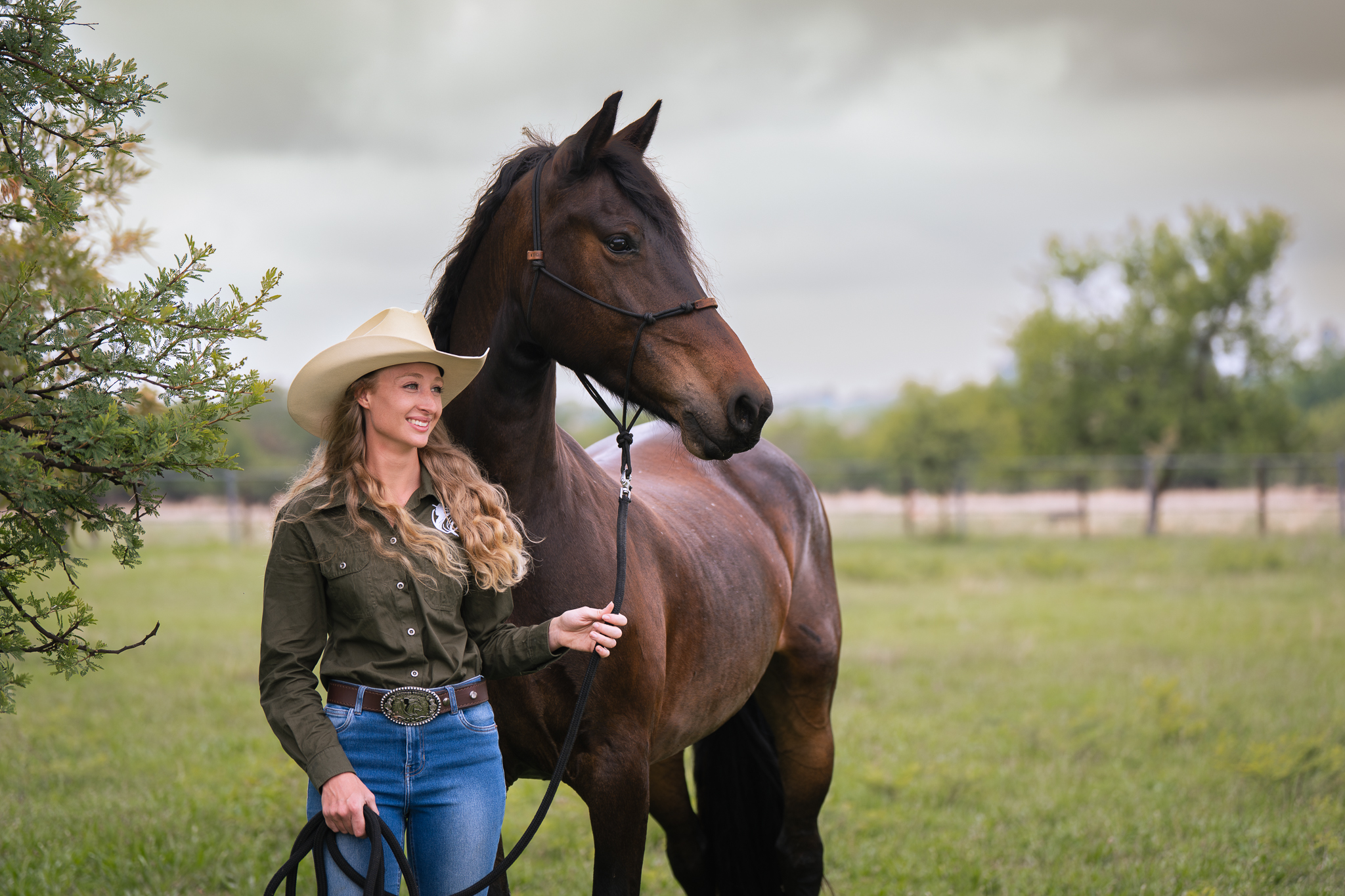 Image of a female horse training graduate student and her horse