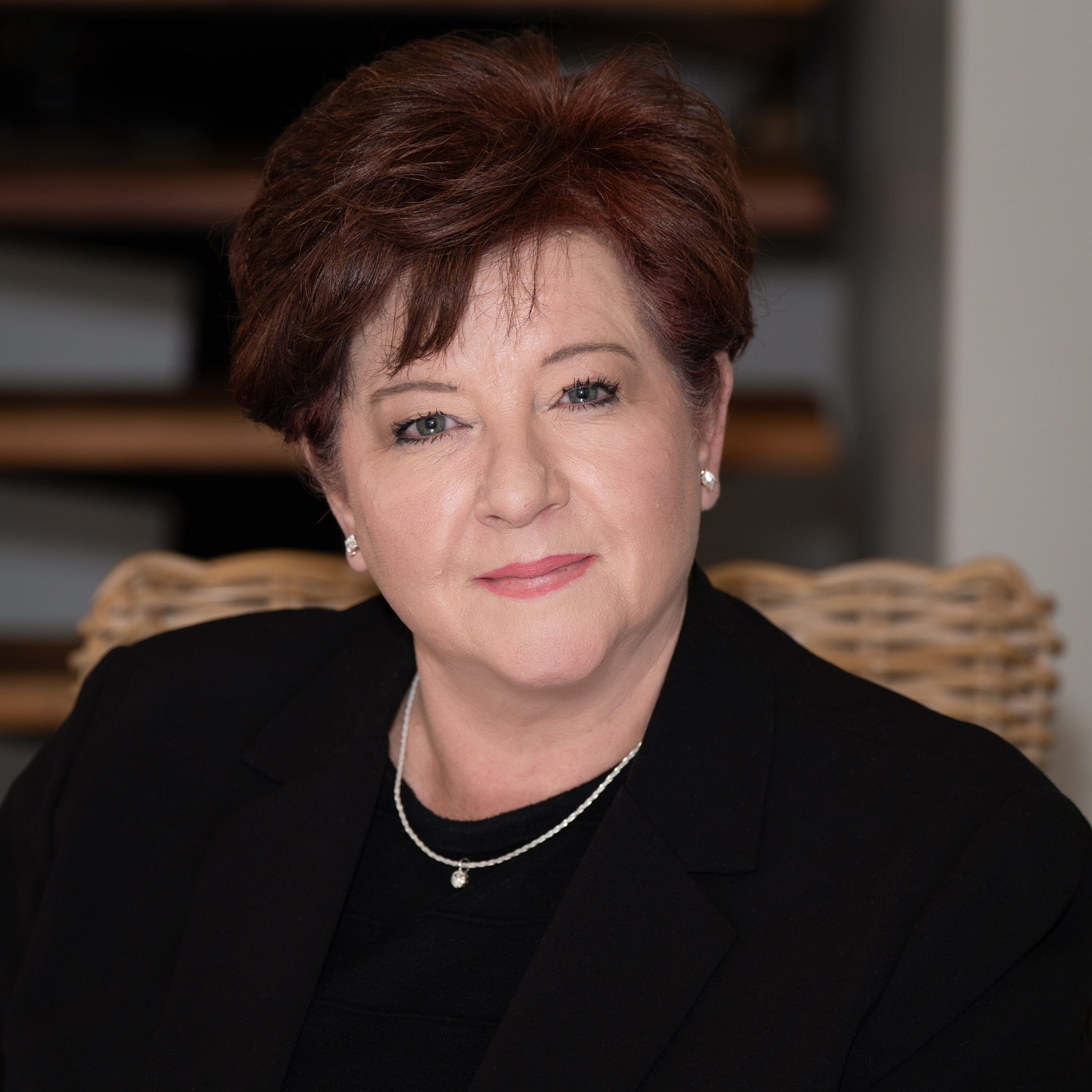 Headshot portrait of a female executive