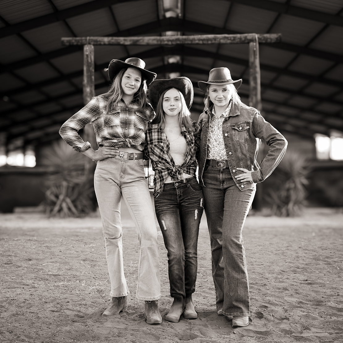 Black and white portrait of three farm girls