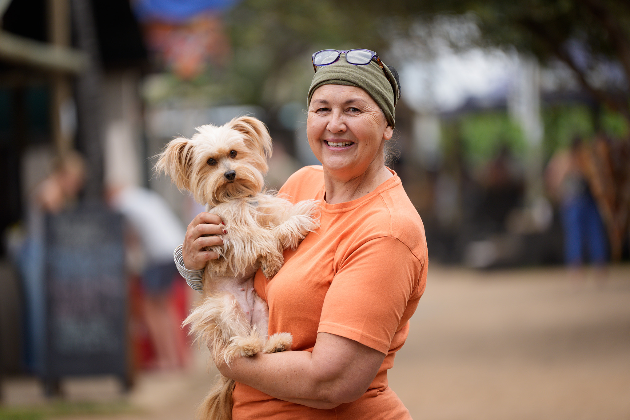 A lady poses with her dog at the Pretoria Boeremark