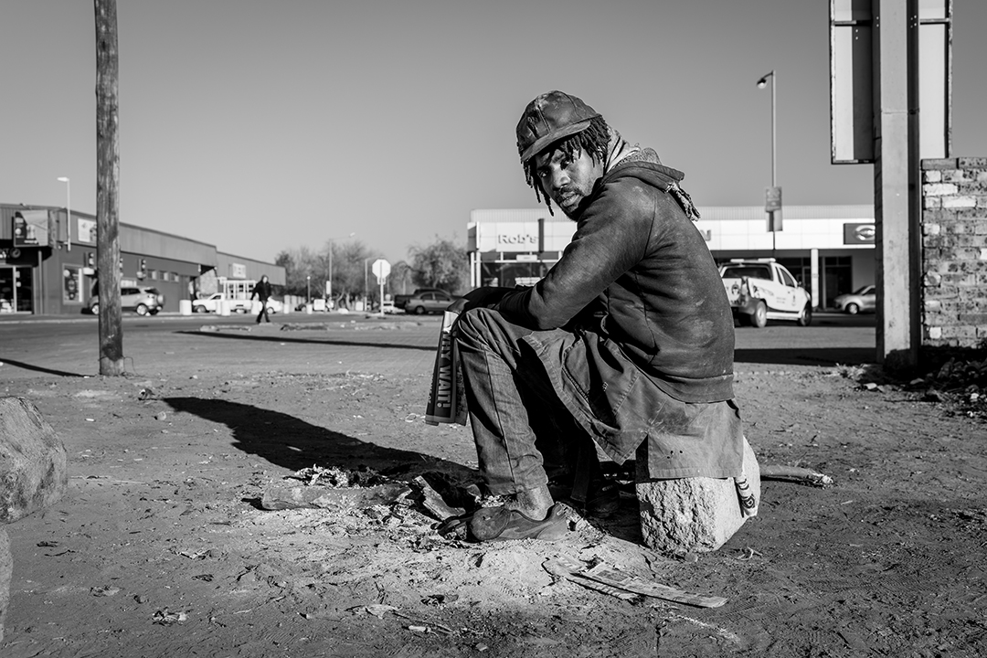 Black and white image of a homeless man