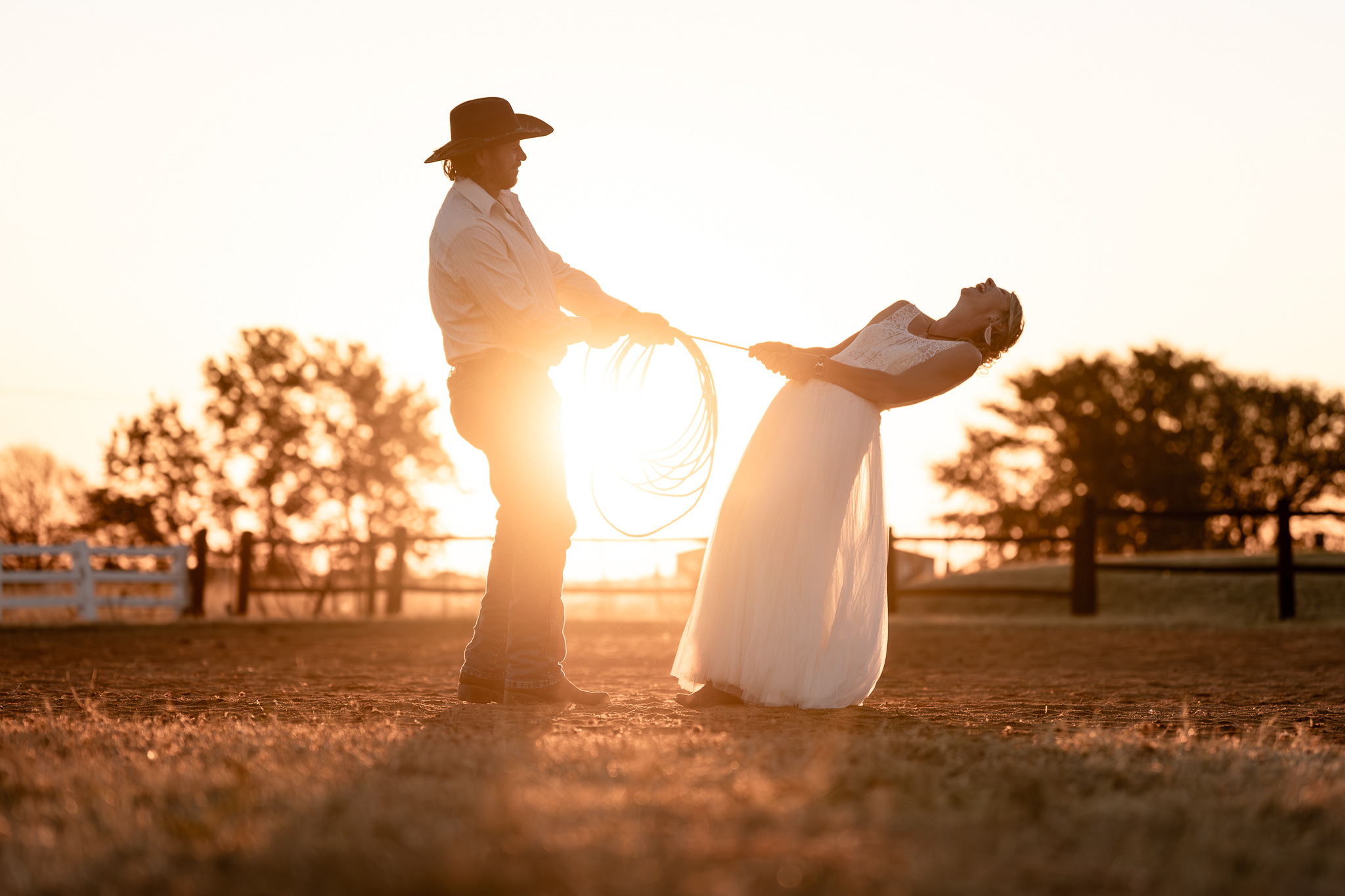 A couple having fun at a western wedding