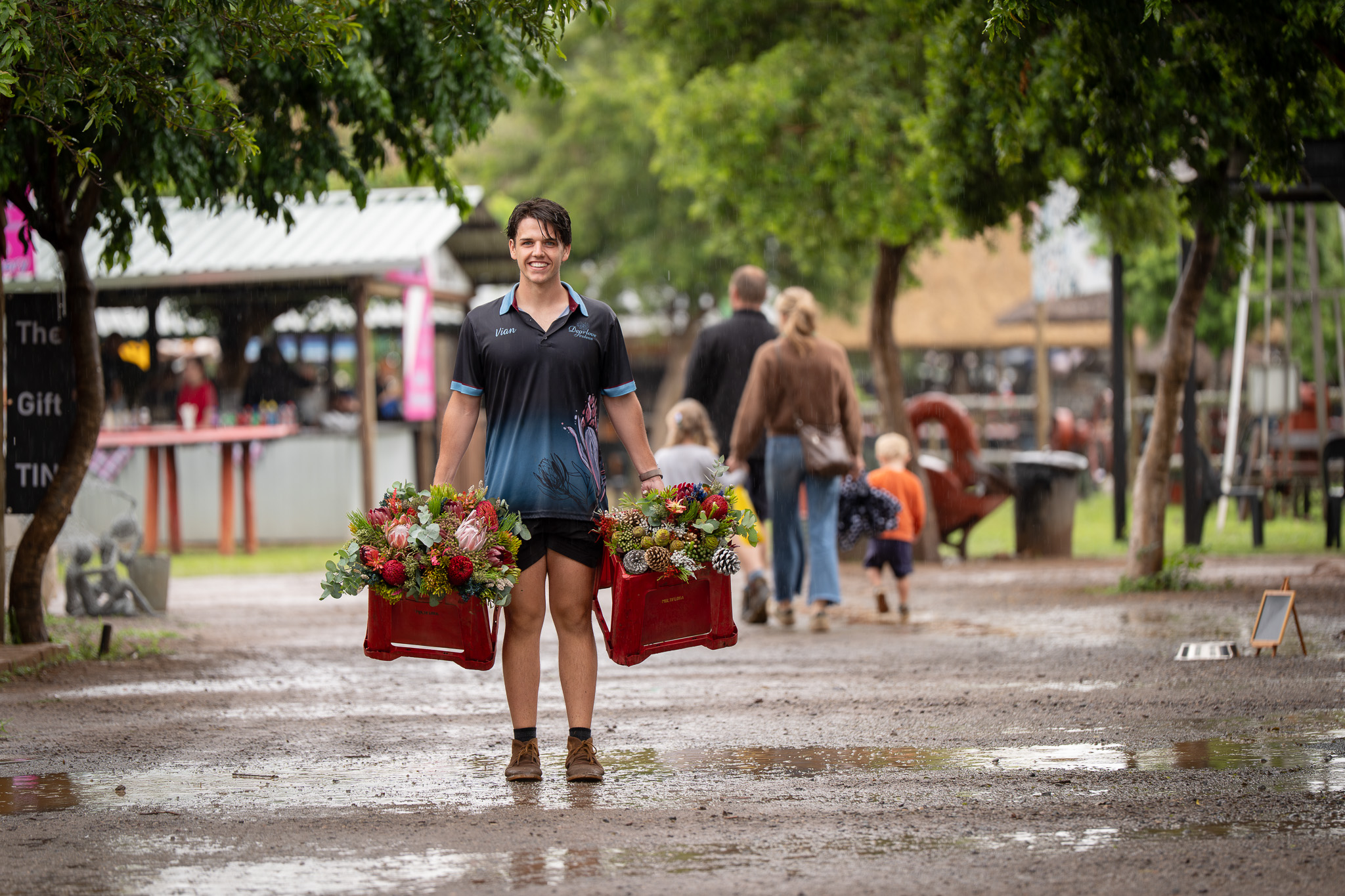 A flower vendor after a rainstorm at the Pretoria Boeremark