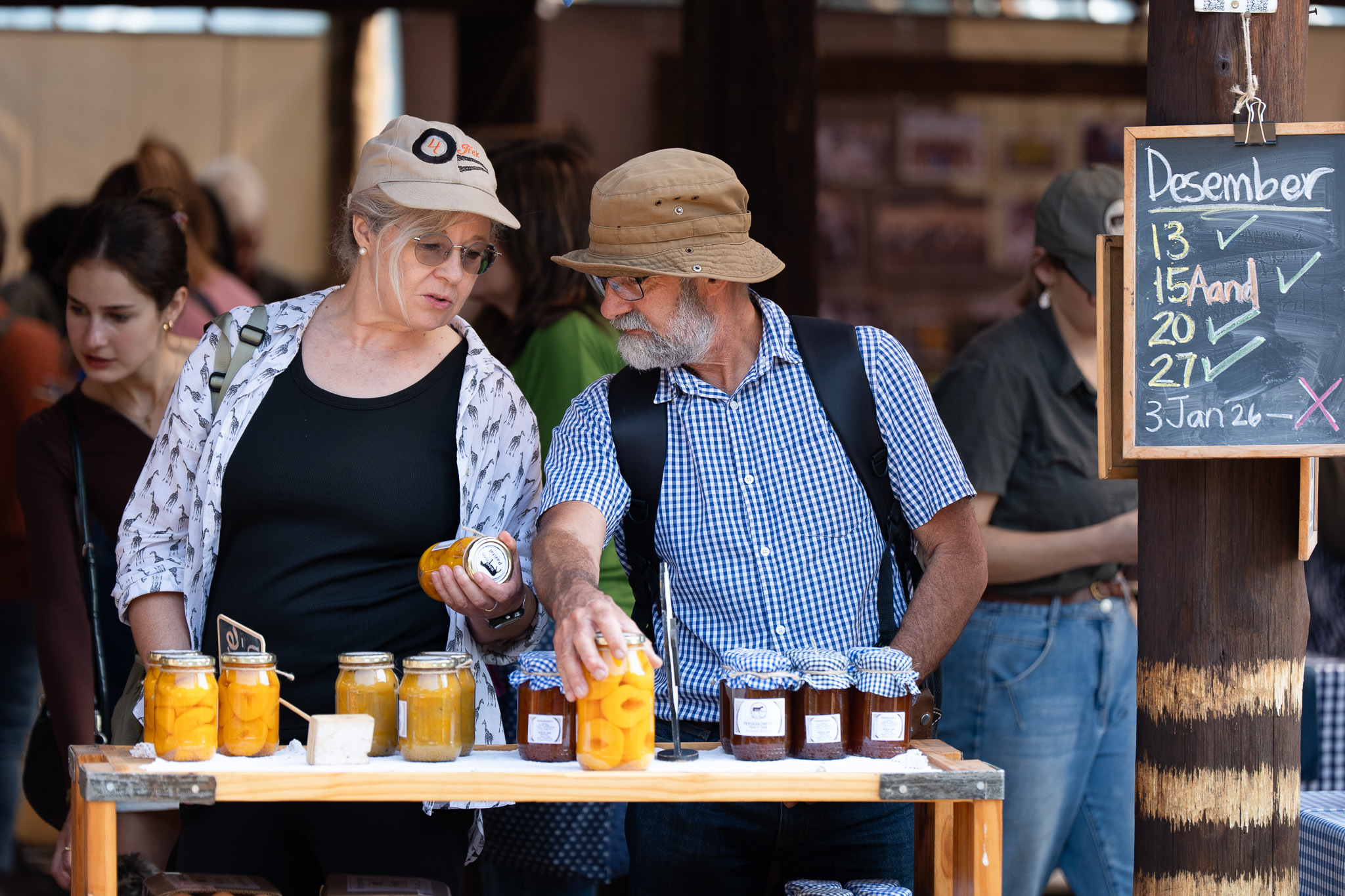 Visitors sample the canned goods at the Pretoria Boeremark