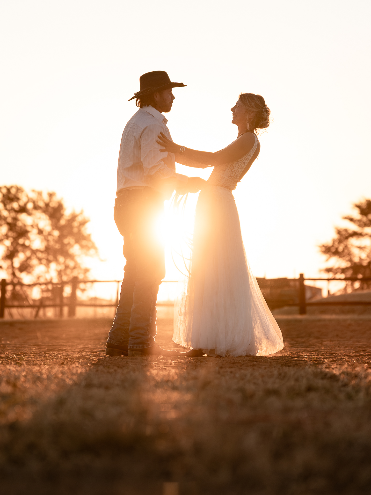 A couple having fun at a western wedding