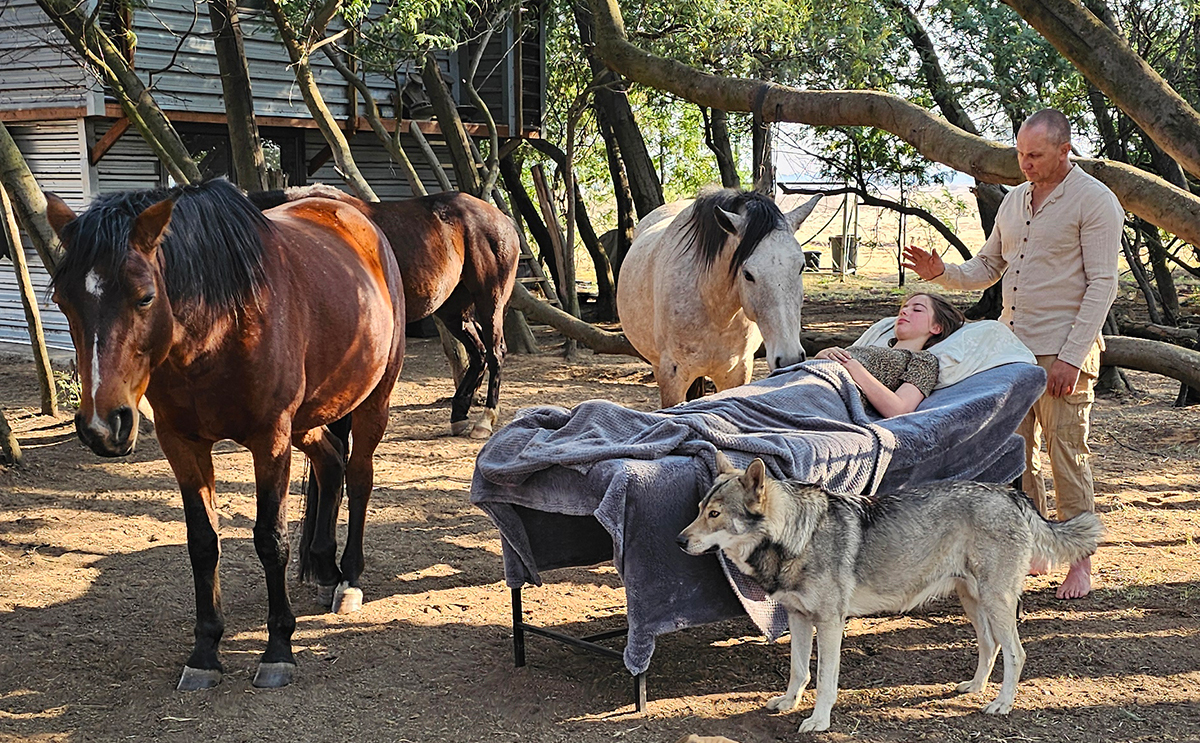 A client enjoying the energy of the horses here at our off grid farm near Bronkhorstspruit
