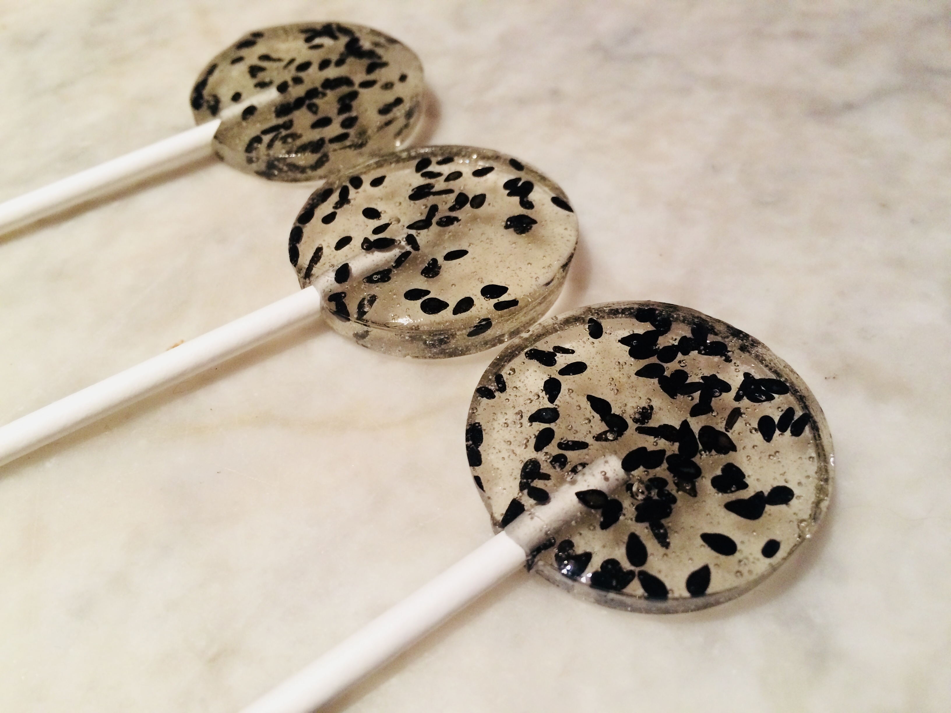 The Lollipop League Coconut lollipop with black sesame seeds inside.Each Lollipop is wrapped