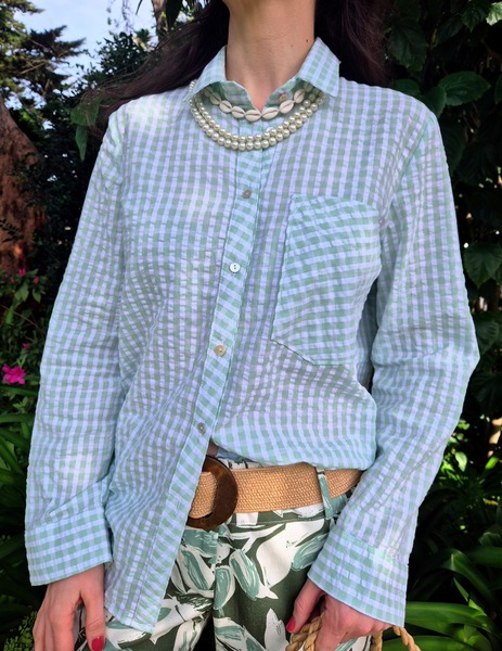 The cut is classic in cut with long sleeves and cuffs. Mother of pearl buttons down centre front, the front collar stand and one pocket are cut on the bias for detail and contrast.
The pistachio green and white check is a beautiful light 100% cotton, roll sleeves up for hotter weather, wear as a loose jacket over a tank top or as a classic shirt, a classic style to see you through many seasons to come.
Kate is wearing a size small
Cotton check has been pre- washed for shrinkage
Cold wash cycle or hand wash only.
Do not Hot wash or Tumble dry.