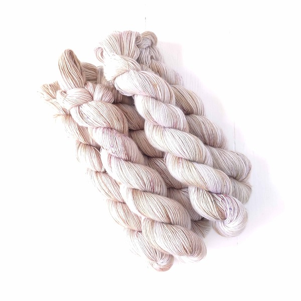 Parchment is a new neutral, variegated yarn in shades of off-white, parchment, beige. It is subtly variegated and speckled - delicate like parchment pages! It will shine on it's own, but also form a lovely rich neutral for colourwork projects.
Care Instructions: For long term fibre and colour care a gentle, PH neutral detergent (preferably natural/organic) and cold water rinse is recommended. Refrain from excessive wringing. Dry flat, avoiding prolonged exposure to harsh sunlight.