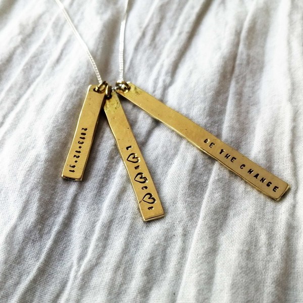 HAMMERED BAR PUNCH Necklaces are hand stamped on hammered brass, copper or silver bars. The bars are 3cm, 4cm and 5cm in length!The bars come on a sterling silver chain in the length of your choice (40, 45, 50 or 55 cm)! Letters can be stamped with 1mm or 2mm lettering, please specify which when placing your order!  Every necklace purchased is packaged in a jewellery box, making it ready for gifting.As necklaces are custom made to your specifications, please allow 5-7 working days for manufacturing and 2-3 working days for delivery!Please supply your choice of chain length when placing your order! (See our FAQ section), as well as the name / initial you want stamped on the various bars!*PLEASE NOTE: Letters are stamped by hand.  We can't guarantee perfection, but we can guarantee that attention to detail is of the highest importance when creating your jewellery piece.