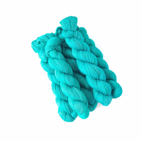 So Jaded is....not at all jaded!
So Jaded is a bright, medium-toned jade turquoise (once again, like Nile Scarab more on the green side of the spectrum). It is delicately layered, although it presents as a semi-solid (a direct result of the pigment strike on this baby). It will provide a jaunty pop of colour to whatever it is added to - or make a statement colourblock hue.
Care Instructions: For long term fibre and colour care a gentle, PH neutral detergent (preferably natural/organic) and cold water rinse is recommended. Refrain from excessive wringing. Dry flat, avoiding prolonged exposure to harsh sunlight.