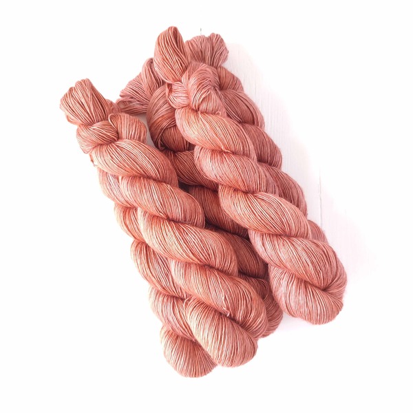 Inspired by the desert sands of the Kalahari - this delicately variegated almost-solid colourway is a type of copper pink-rust - a 'pastel' version of a rust with a hint of grey at the base. It's delicate, and will pair very well with neutrals and pale greys or blues. If you are looking for more rust/spice - Rooibos Embers is the one to pick.
Care Instructions: For long term fibre and colour care a gentle, PH neutral detergent (preferably natural/organic) and cold water rinse is recommended. Refrain from excessive wringing. Dry flat, avoiding prolonged exposure to harsh sunlight.