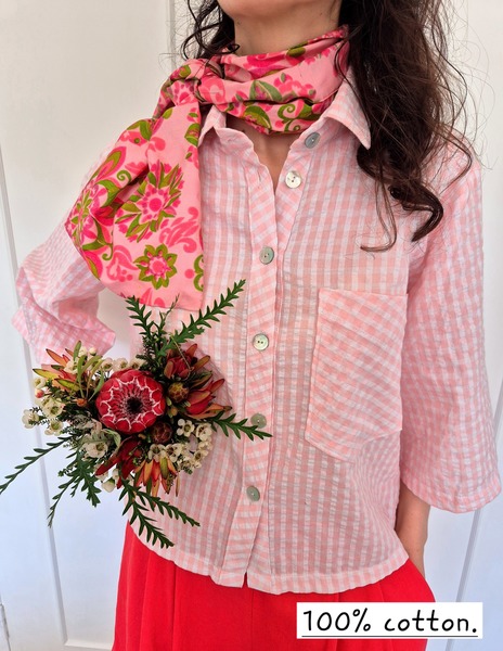 The classic button down shirt in pink and white cotton check is cropped to low waist and has 3/4 flared sleeves.
Kate is wearing a size small.
Cotton check has been pre washed 
cold wash cycle or hand wash only
Do not Tumble dry or hot wash
